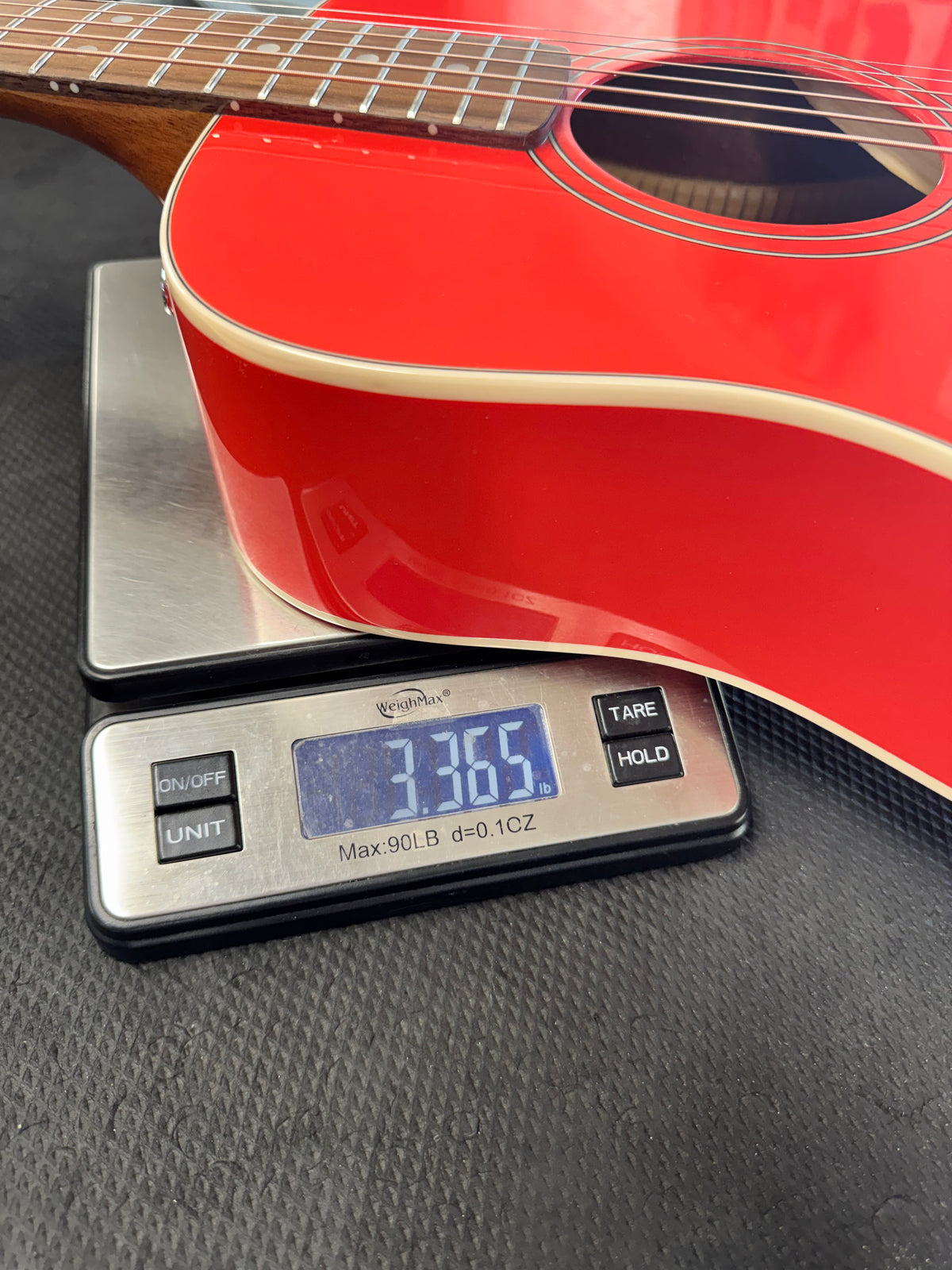 Fender California Standard Redondo Mini - Fiesta Red - on our store scale, 3.37 lb