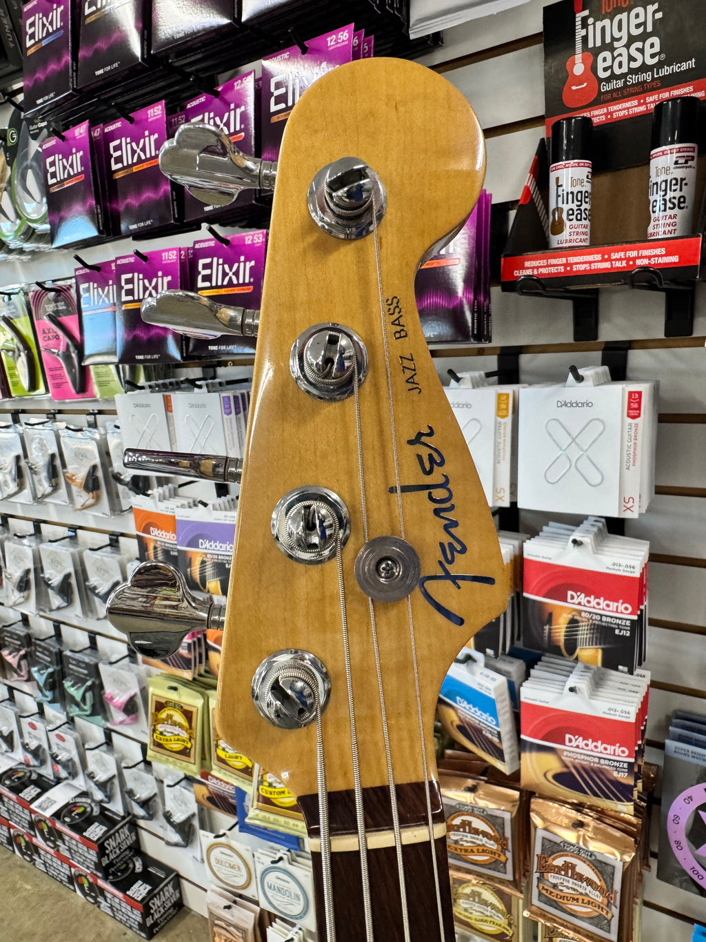 Used 2003 Fender American Deluxe Jazz Bass, 3-Color Sunburst - headstock with Fender logo
