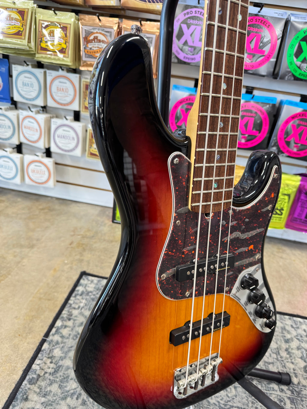 Used 2003 Fender American Deluxe Jazz Bass, 3-Color Sunburst - angled body view