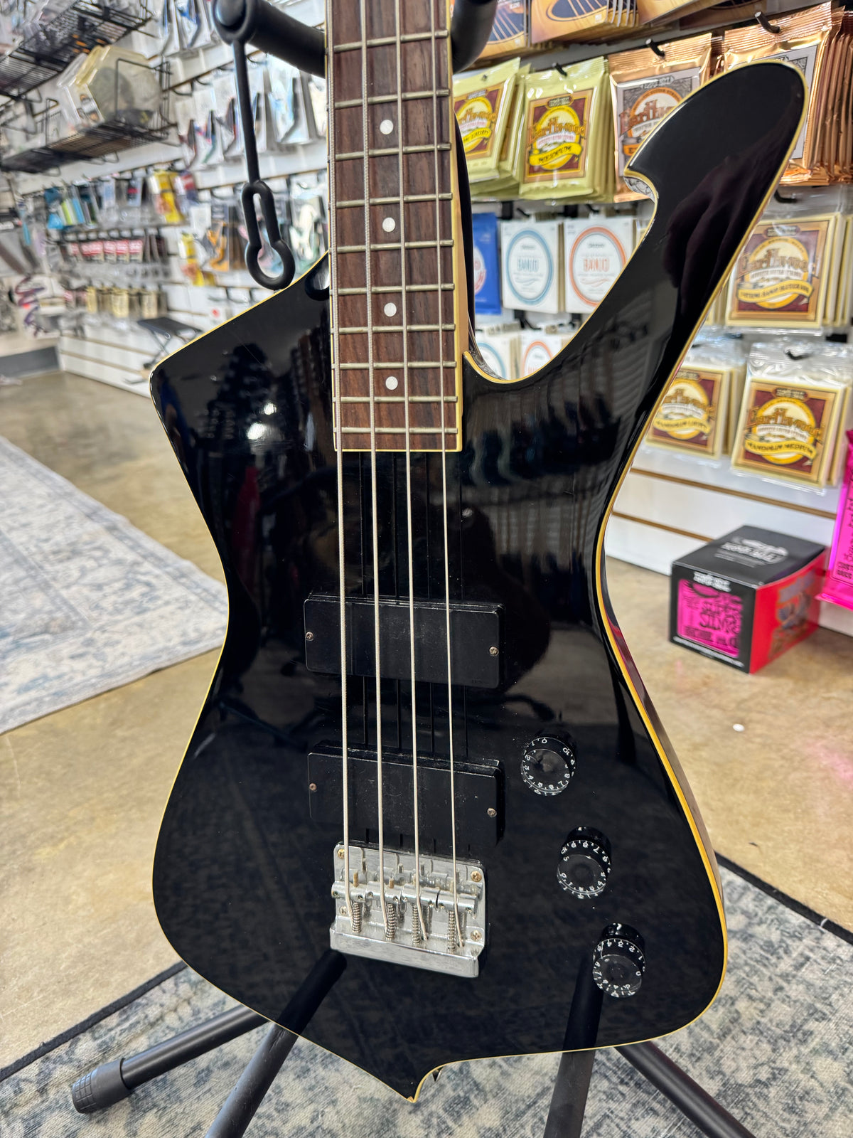 Used Ibanez ICB300 Iceman Bass, Black - angled view of Iceman body shape