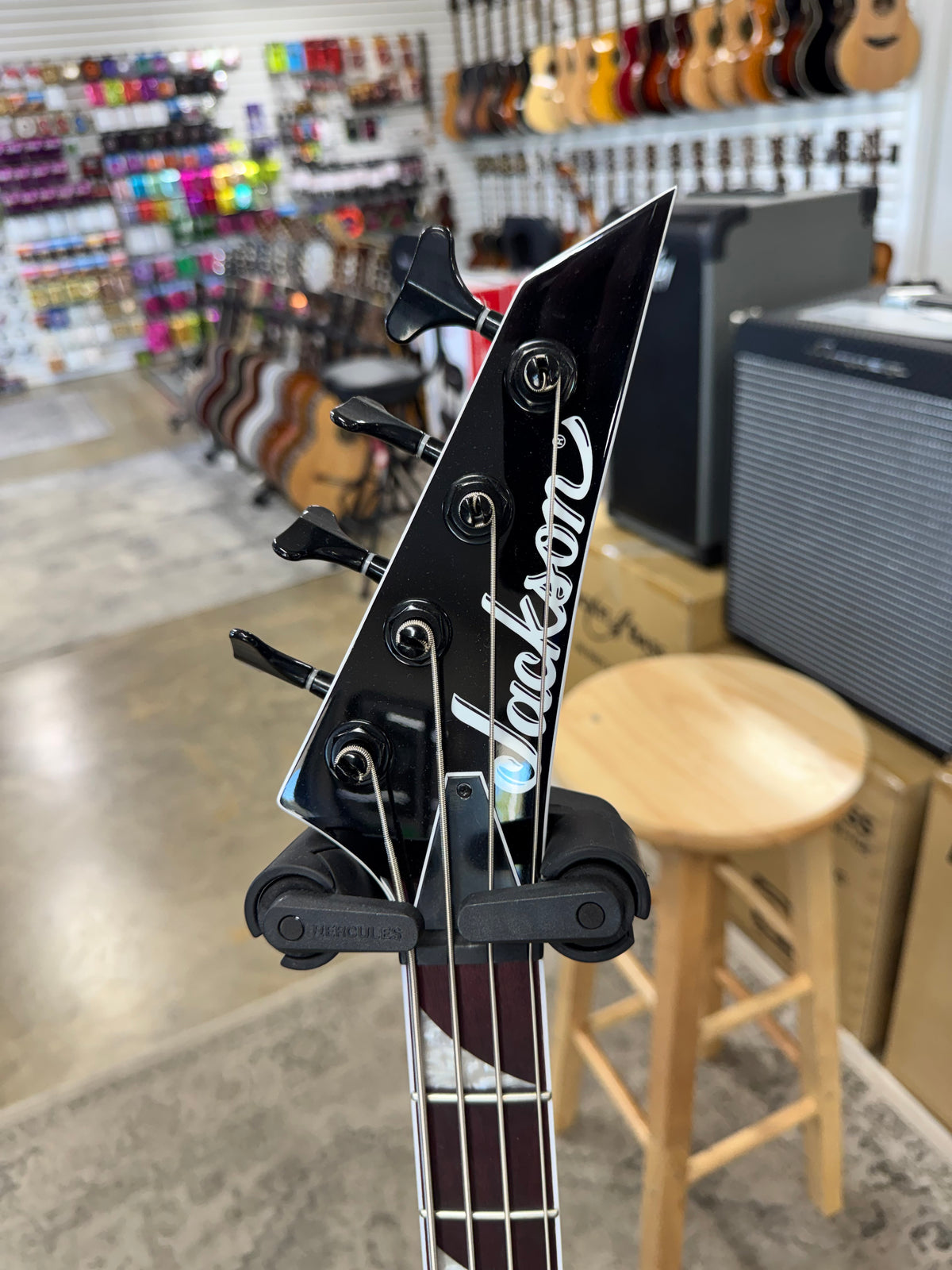 Used Jackson X Series Rhoads RR-B IV bass, Black with white pinstripes - pointed Jackson headstock