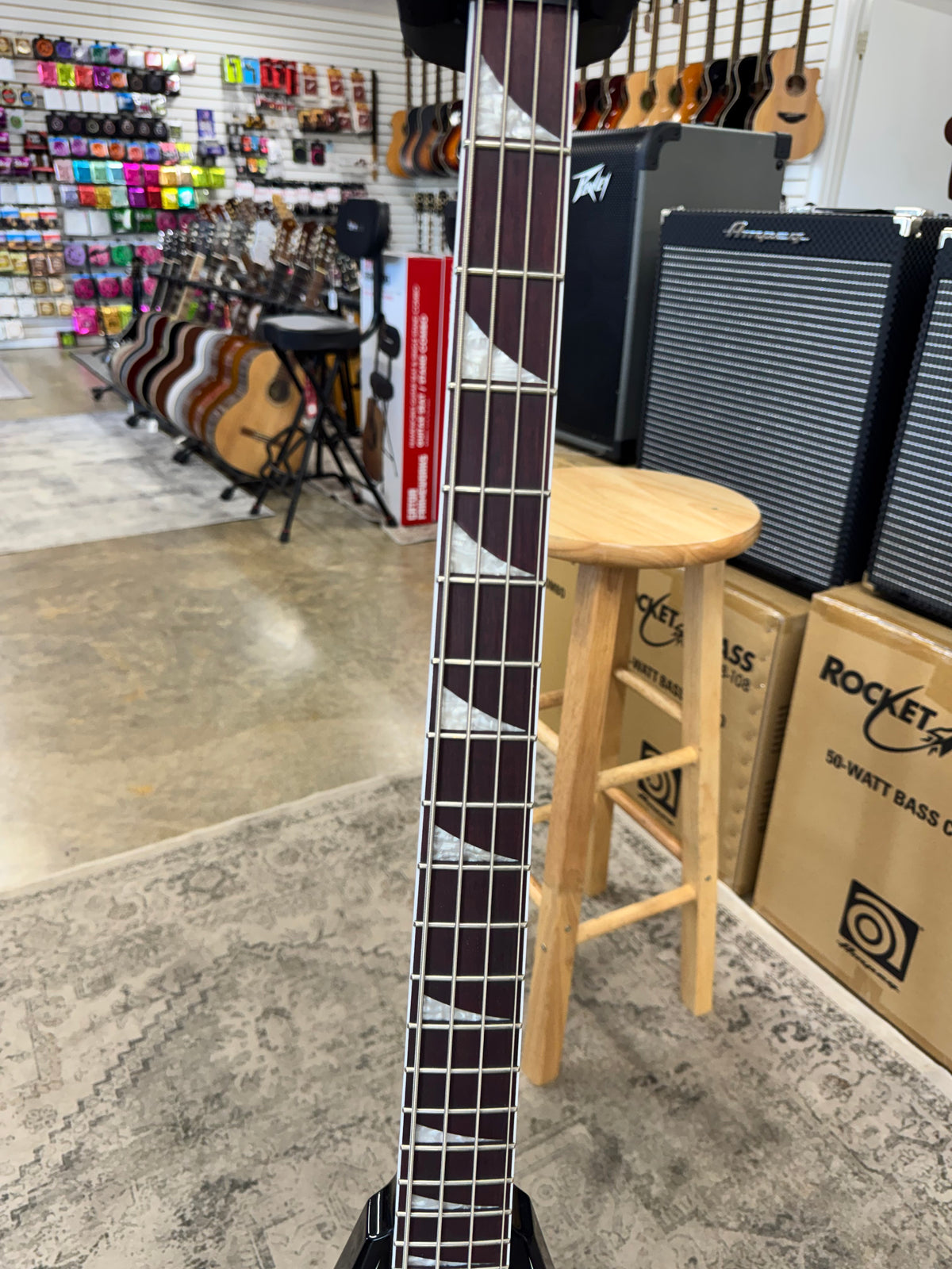 Used Jackson X Series Rhoads RR-B IV bass, Black with white pinstripes - fretboard with sharkfin inlays
