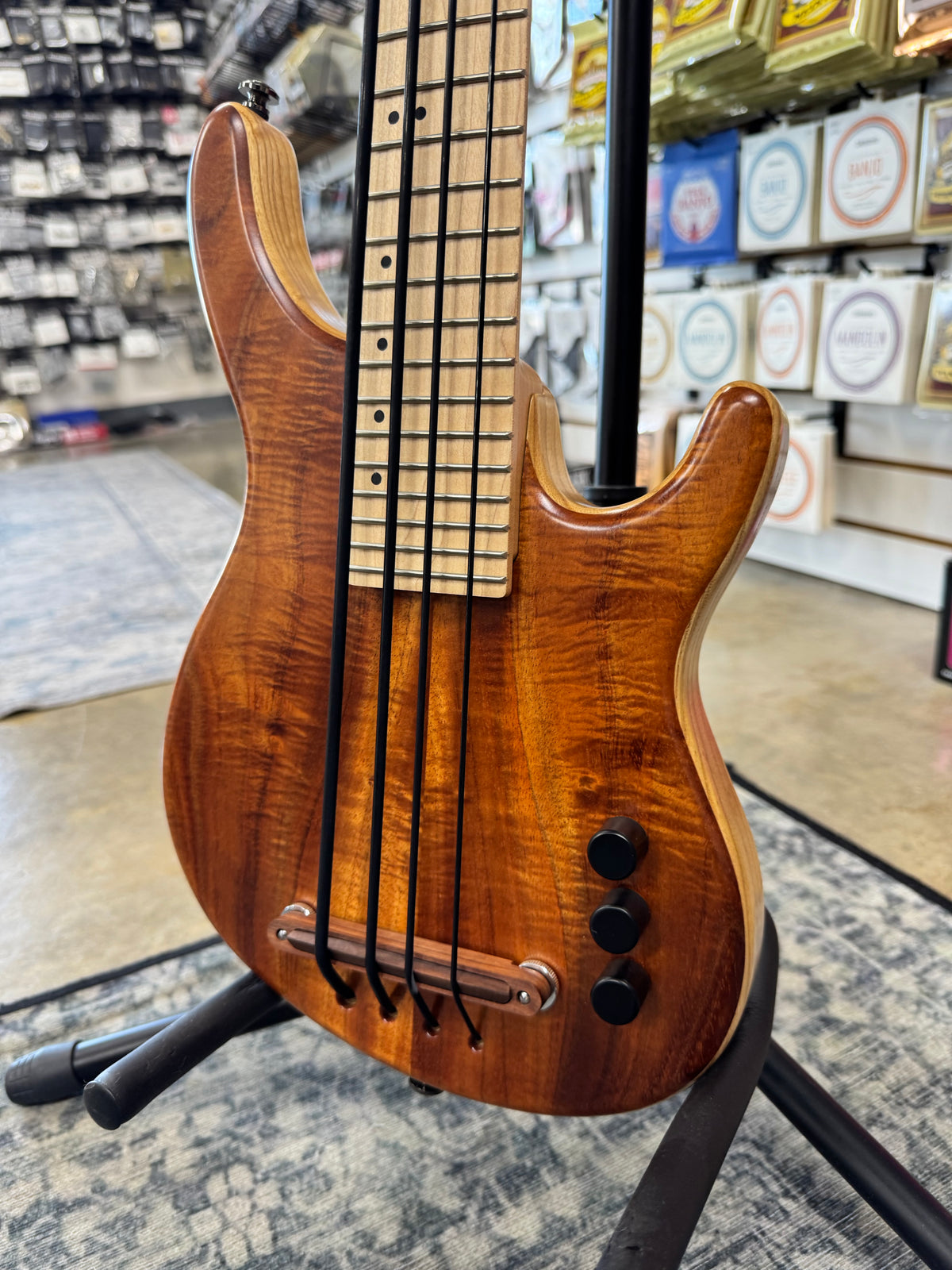 Used Kala Hawaiian Koa California U-Bass, Natural - angled view of body and controls