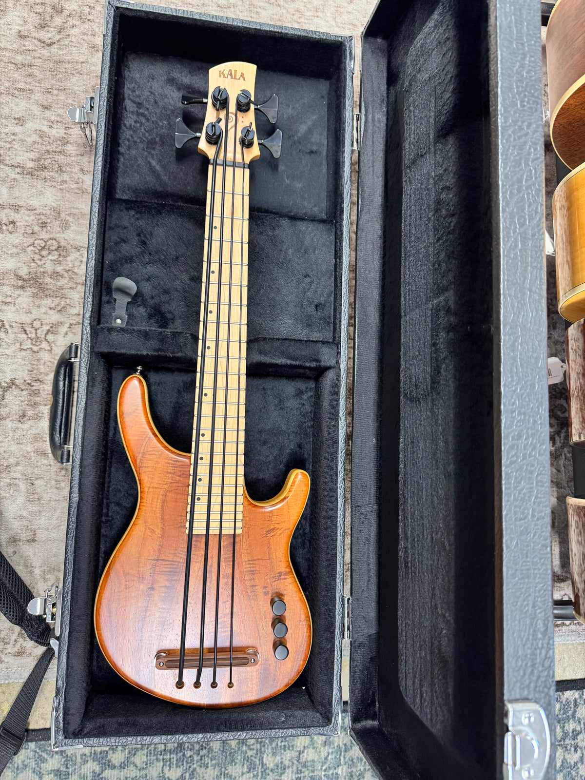 Used Kala Hawaiian Koa California U-Bass, Natural - shown in its included case