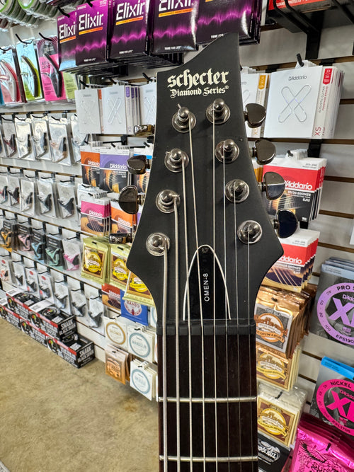 Used Schecter Omen-8 8-string guitar, Walnut Satin - headstock with Schecter logo