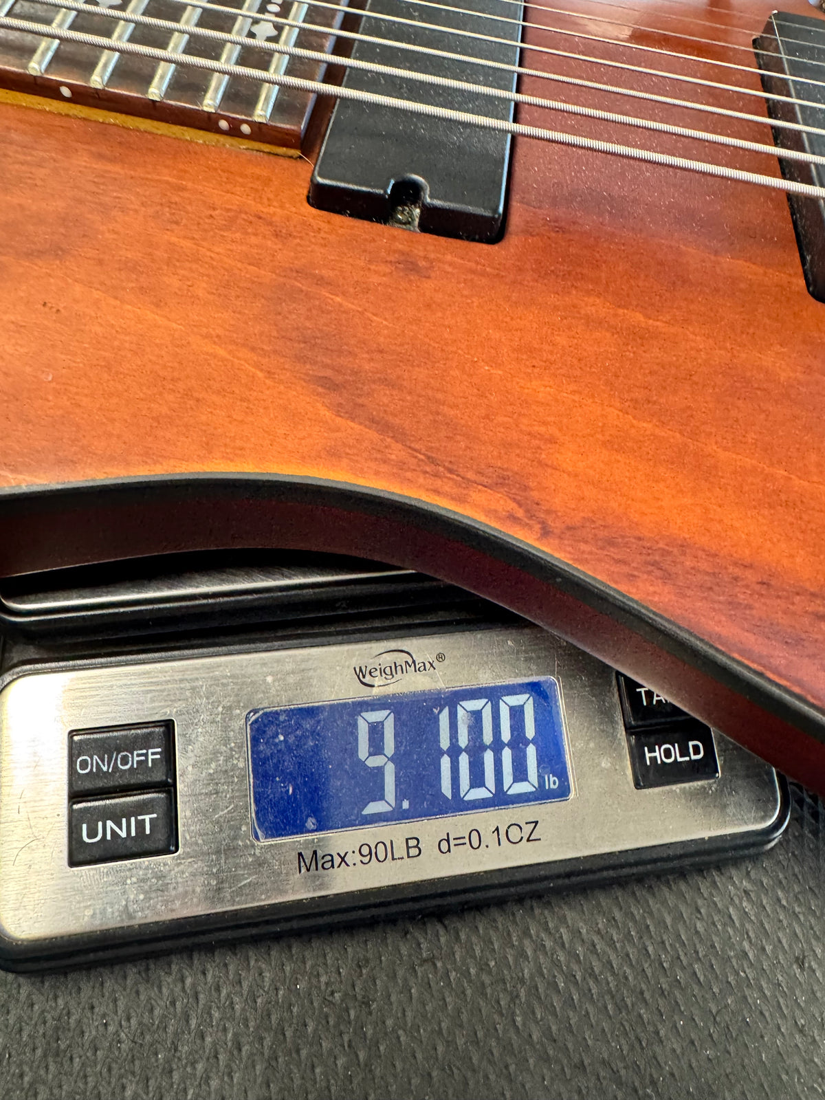 Used Schecter Omen-8 8-string guitar, Walnut Satin - on a scale, about 9.1 lb