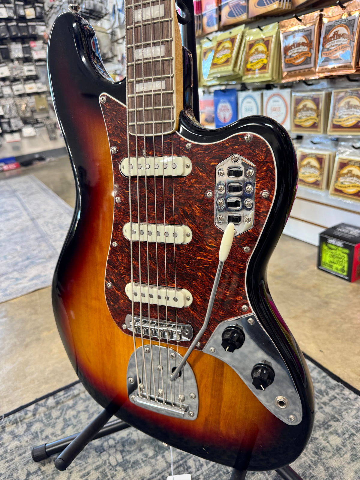 Used Squier Classic Vibe Bass VI, 3-Color Sunburst - angled body view with vibrato arm