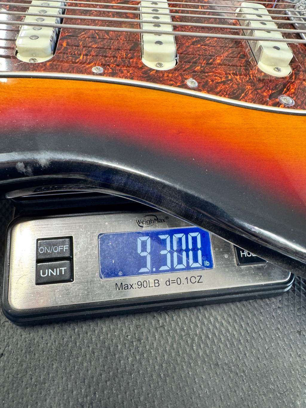 Used Squier Classic Vibe Bass VI, 3-Color Sunburst - on a scale, about 9.3 lb