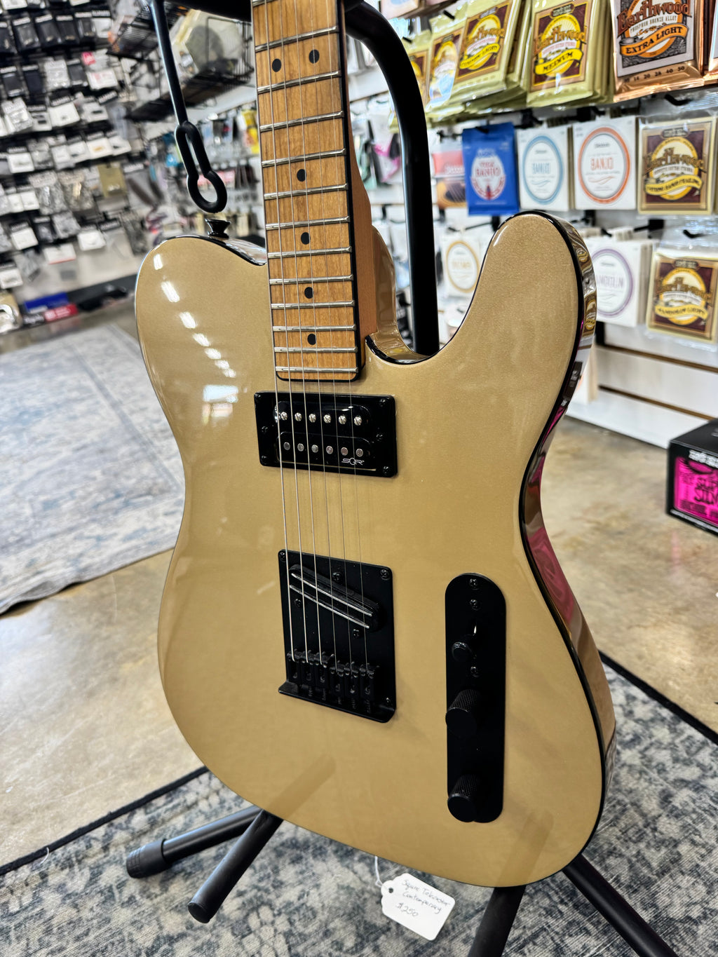 Used Squier Contemporary Telecaster RH, Shoreline Gold - angled view of pickups and controls