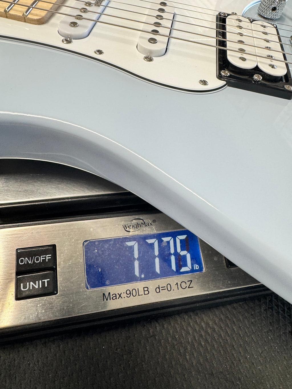 Used Yamaha Pacifica PAC112VM, Ice Blue - on a scale, about 7.75 lb